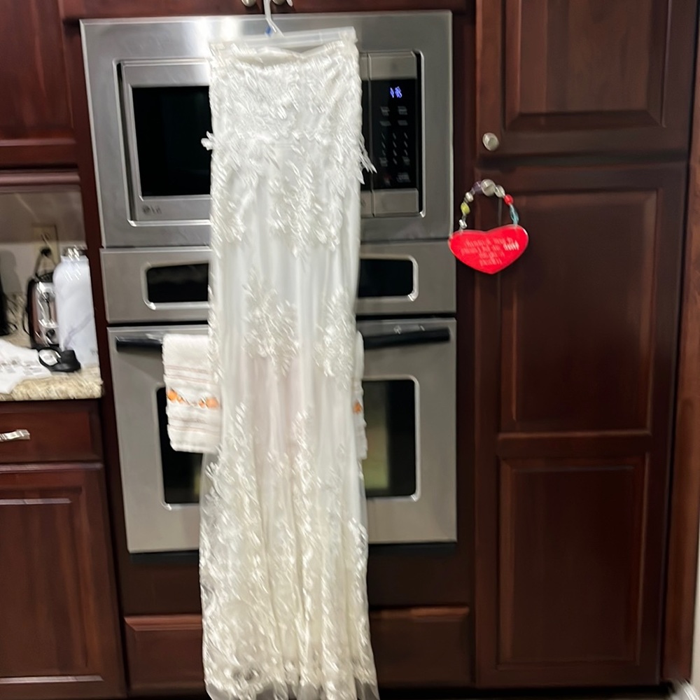 Woman’s white lace wedding gown